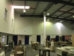 View of workshop area showing joinery benches, storage area and external view of the offices on first floor