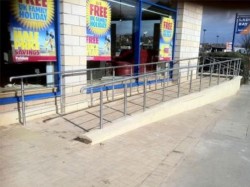 Equal access ramp constructed from concrete and finished in brick to match area, complies to DDA regulations