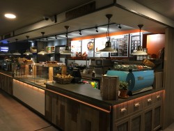 Bespoke servery counter made from Corian worktop, karndean vinyl planking frontage, mild steel trims and LED strip lighting