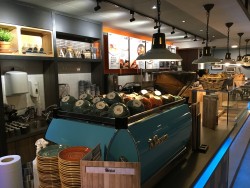 Bespoke servery counter made from Corian worktop, karndean vinyl planking frontage, mild steel trims and LED strip lighting