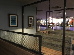 Mild steel framed with ribbed glass central section and mild steel frame to hang pendant lighting