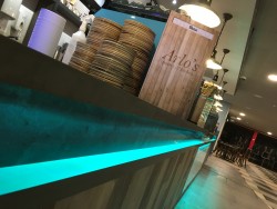 Bespoke servery counter made from Corian worktop, karndean vinyl planking frontage, mild steel trims and LED strip lighting