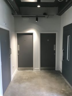 Toilet entrance doors finished in laminate to match steel work throughout